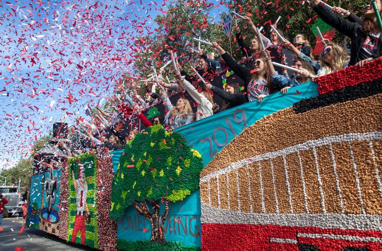 Red and white confetti around a float on St. Mary Boulevard for UL 69传媒 Homecoming